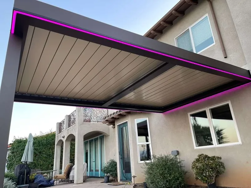 Attached Four Seasons louvered roof with latte blades and LED strip lighting around the perimeter